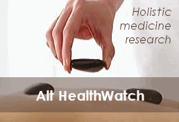image of hand placing stones - holistic medicine research
